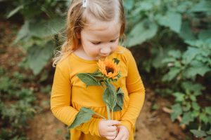 Little Girl with Sunflower