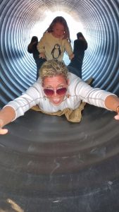 An adult enjoying the slide