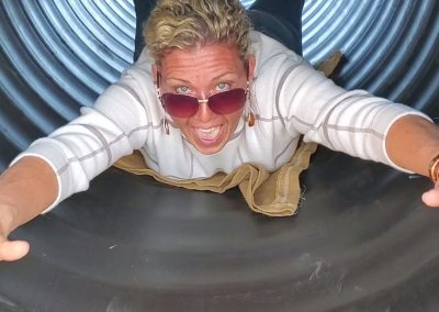 An adult enjoying the slide