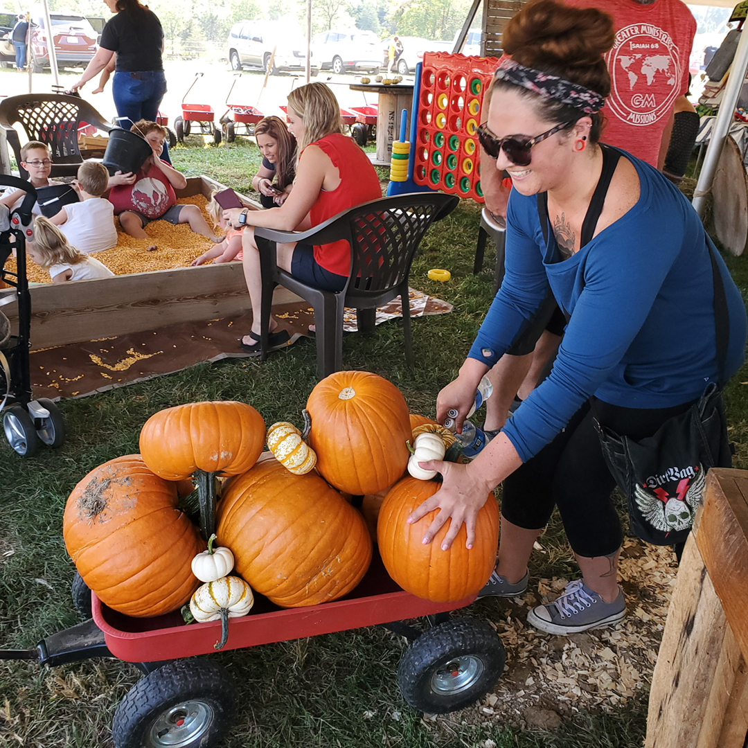 Loading up a wagon with pumpkins