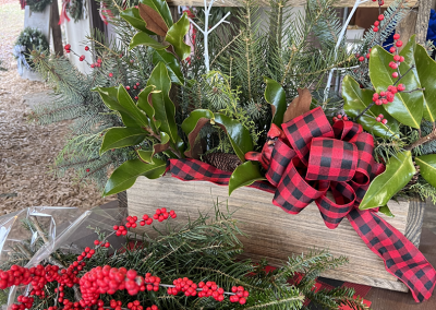Some evergreen and cranberry sprays and table arrangements