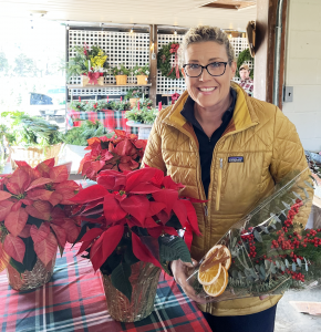Laura showing a seasonal spray as well as poinsettias
