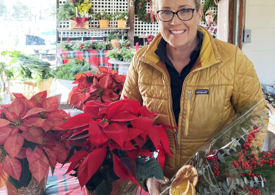 Laura showing a seasonal spray as well as poinsettias